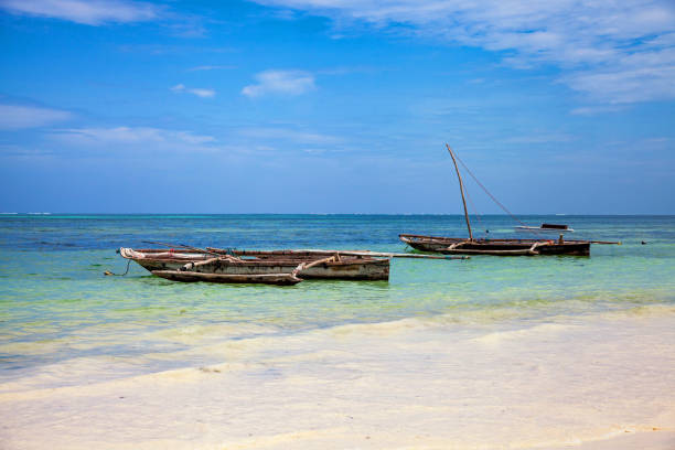istock Old fisher boats on the beach during low tide on ocean 1468102014