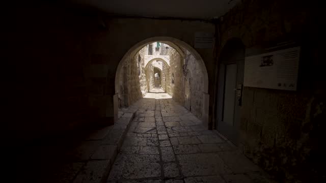 Walking Through Dark Tunnel Archway At Western Wall In The Old City of Jerusalem In Israel. - POV, dolly forward