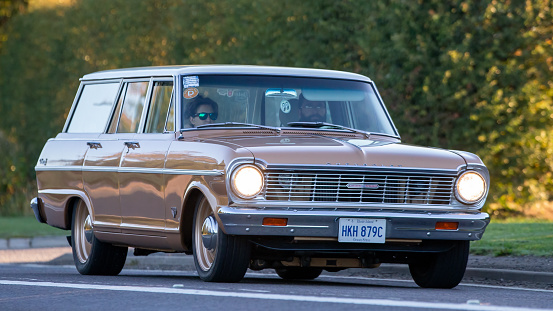 Bicester,Oxon,UK - Oct 9th 2022. 1965 Chevrolet Nova station wagon driving on an English road