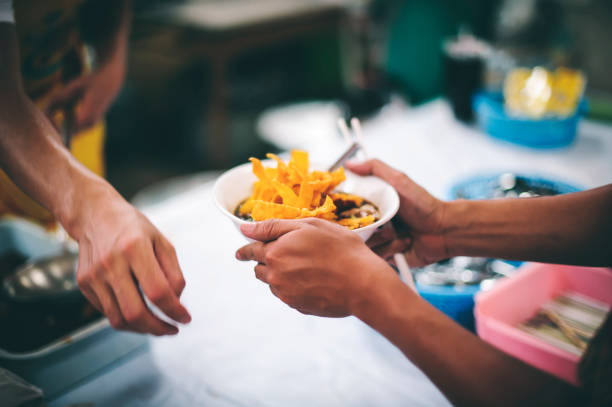 istock Sharing food with the poor in Thailand 1468116147