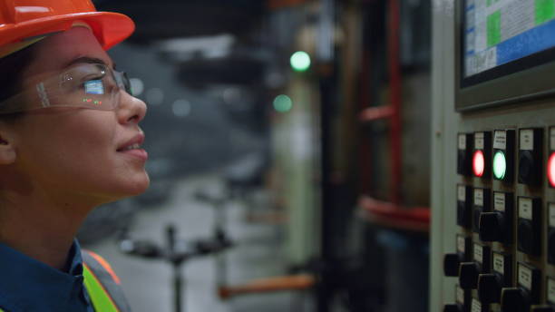 istock Woman supervisor looking modern factory machine screen at facility closeup 1468116245