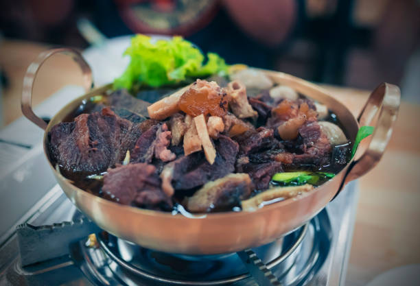 istock Braised beef in a brass pan set on the gas stove 1468117187