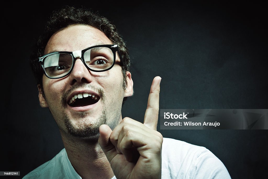 The Nerd Nerd young  guy wearing white t-shirt against a gray background Adult Stock Photo