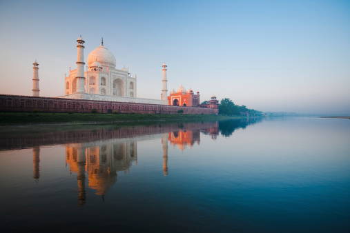 A beautiful sunrise lights the side of the Taj Mahal early morning from the 