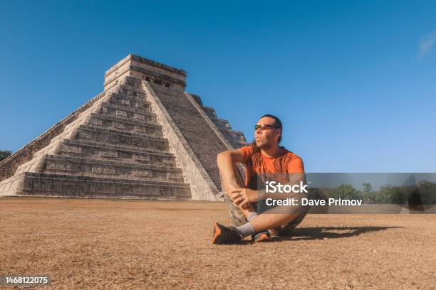 White Man Tourist Near Ancient Precolumbian Maya Civilization Pyramid Temple Of Kukulcán In Chichen Itza Stock Photo - Download Image Now