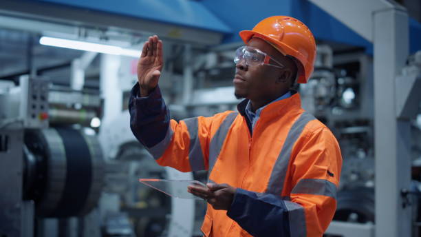 istock Analyst using modern glass tablet computer at machinery factory. Hitech concept 1468123213