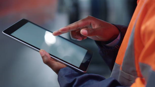 istock Hands scrolling tablet screen at manufacture company closeup. Modern technology 1468123628