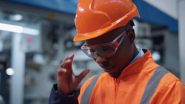 istock Portrait supervisor industrial factory. Uniformed engineer analyzing results 1468124377
