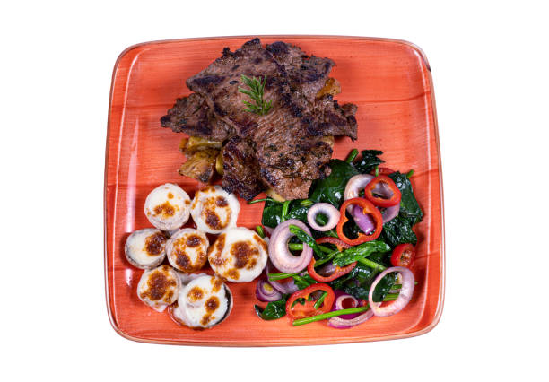 Grilled beef slices with vegetables. Serving a dish in a restaurant, photo for the menu