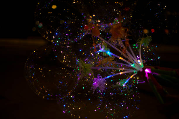 istock Colored balls in dark. LED Light. Transparent ball with colored lights. 1468125075