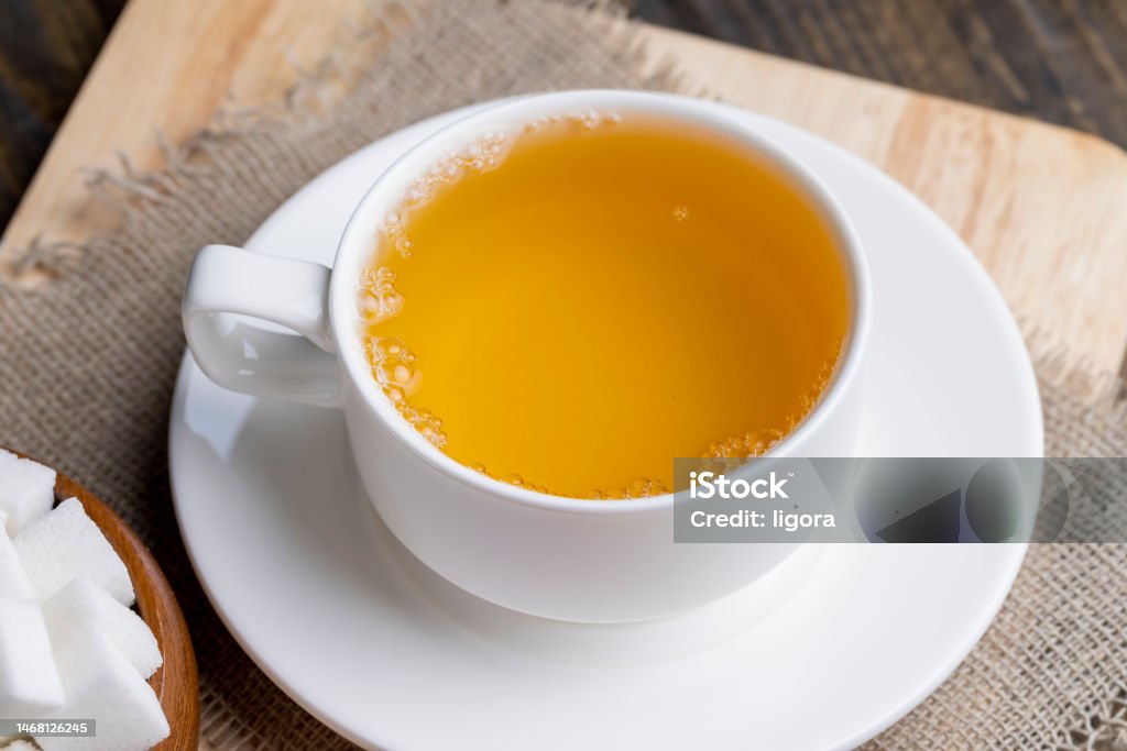 hot tea brewed in a white mug hot tea brewed in a white mug, cooking breakfast with hot tea and dessert Antioxidant Stock Photo
