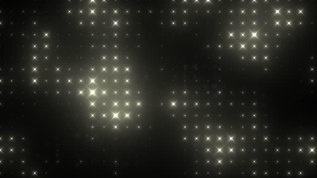 Abstract glowing yellow bright light bulbs disco wall abstract background. Video 4k