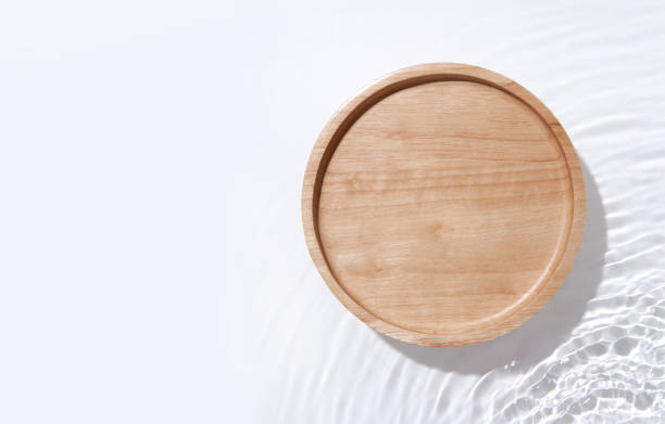 istock Wooden plate on the water surface background. Flat lay, copy space. 1468131962