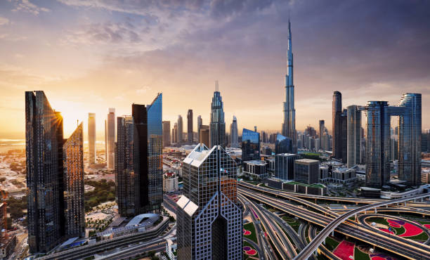 Dramatic sunrise over Dubai skyline panorama with Burj Khalifa and luxury skyscrapers, United Arab Emirates stock photo