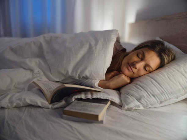 istock Young woman sleeping in bed. 1468137838