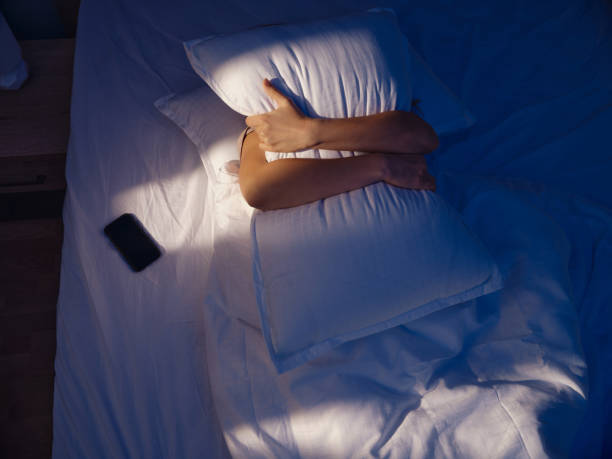 istock Above view of hugging a pillow during a sleep. 1468137938