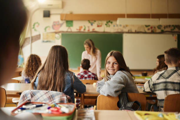 istock Happy schoolgirl on a class in the classroom. 1468138248