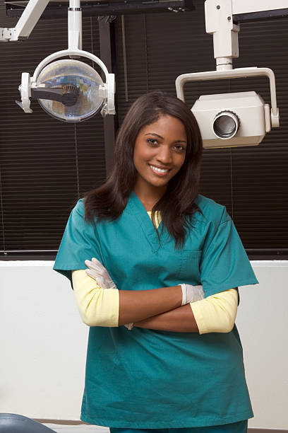 istock Friendly African-American dentist woman in office 146814031