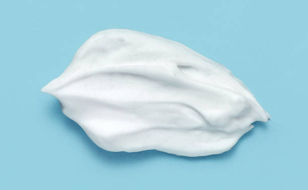 istock Shaving cream isolated on blue color background. 1468140740