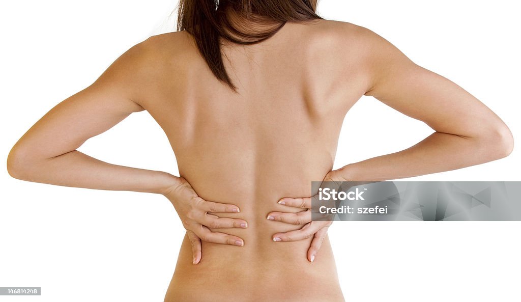 Back ache Woman with backache from behind, naked body. Rear View Stock Photo