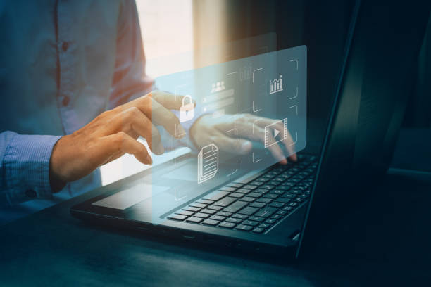 istock Businessmen protecting personal data on laptop and virtual interfaces. 1468142615
