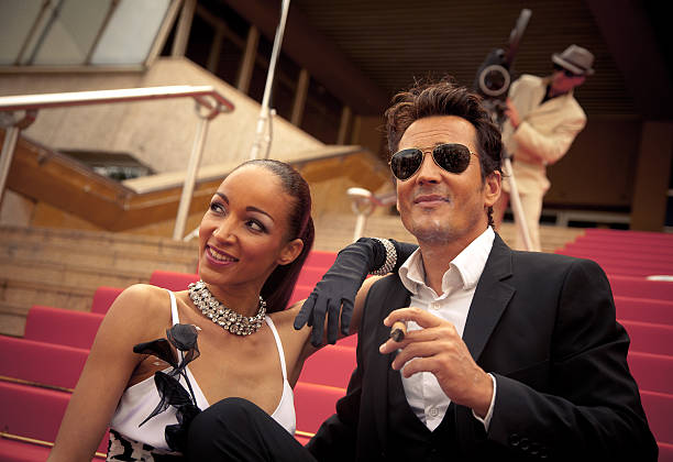 istock celebrity couple posing for photographers 146814271