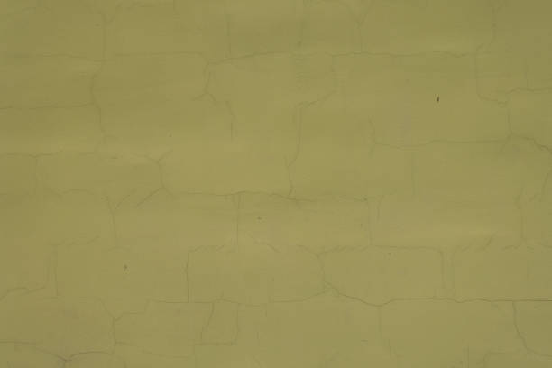 istock Background - greenish yellow painted wall with cracks 1468144809