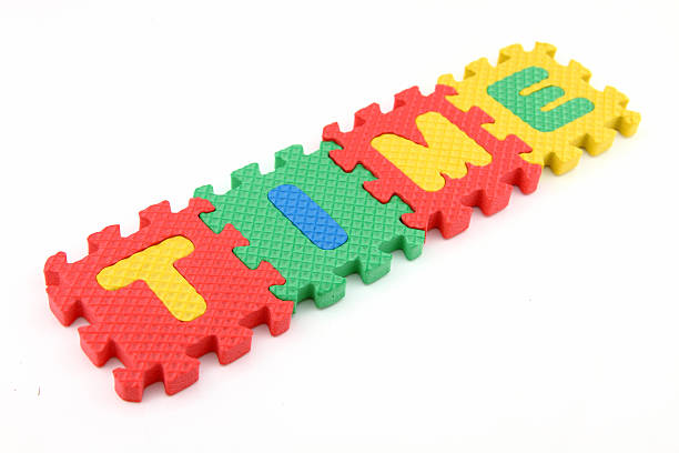 TIME word with alphabet puzzle stock photo