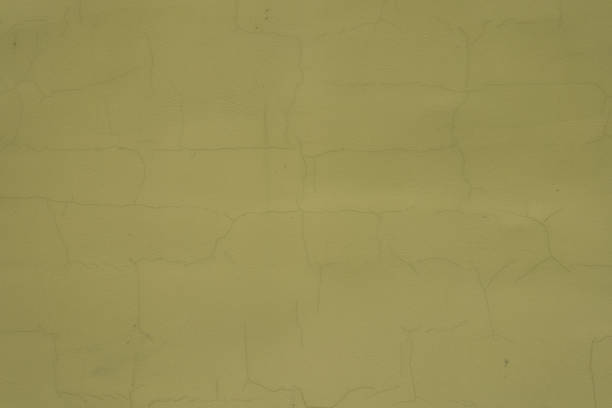 istock Surface of greenish yellow painted wall with cracks 1468146294