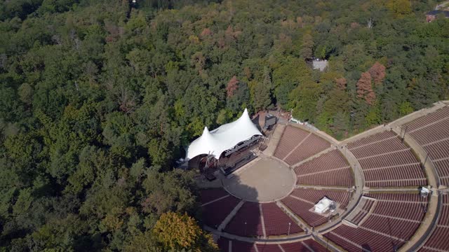 no people absolutely no one at corona pandemic.
Amazing aerial view flight panorama orbit drone
of Open-air stage Waldbühne Berlin Germany at summer day 2022. 4k marnitz cinematic