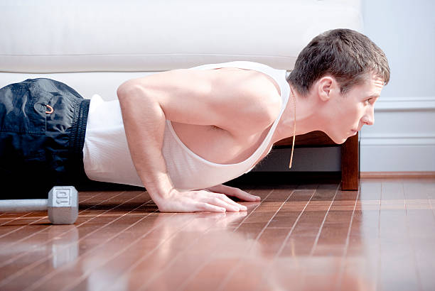 istock Man Doing Push-ups in Living Room 146815466