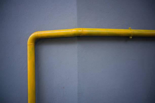 istock yellow tube on edge of a wall 1468155295
