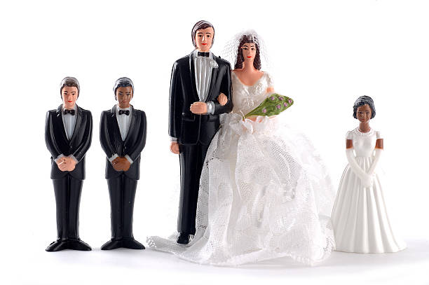 The groom holds the bride's hand tightly. Family and relationships.