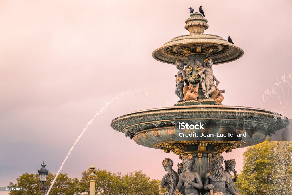 Fontaine des Mers at sunset in Paris on the Place de la Concorde Fontaine des Mers at sunset in Paris on the Place de la Concorde, France Beauty Stock Photo