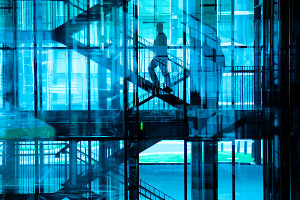 Walking upstairs in modern building stock photo