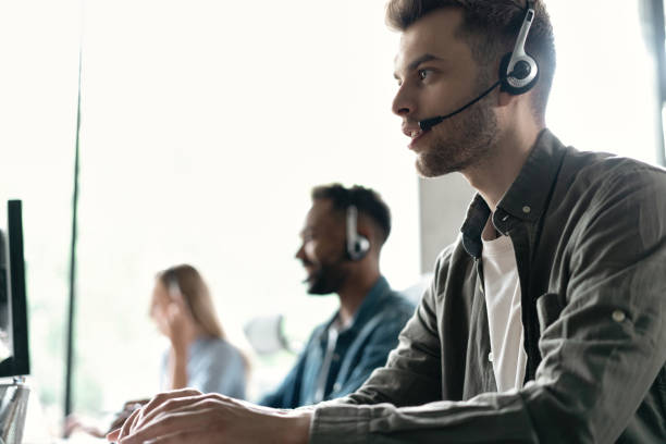 istock Happy young male customer support executive working in office 1468160385