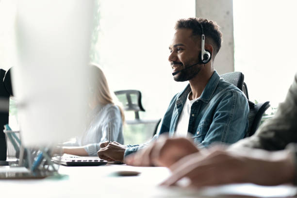 istock Happy young male customer support executive working in office 1468160389
