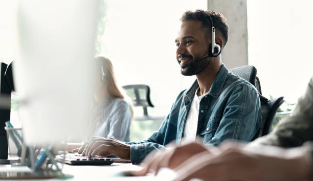 istock Happy young male customer support executive working in office 1468160393