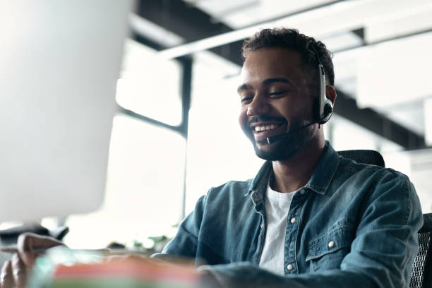 istock Happy young male customer support executive working in office 1468160410