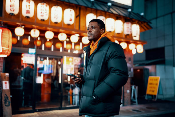 istock Mid adult man exploring Japanese night life 1468162358