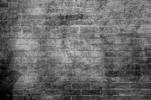 Abstract dirty or scratch aging effect. Dusty and grungy scratch texture material or surface. Use for overlay effect vintage grunge style design . Black brick wall texture, brick surface as background