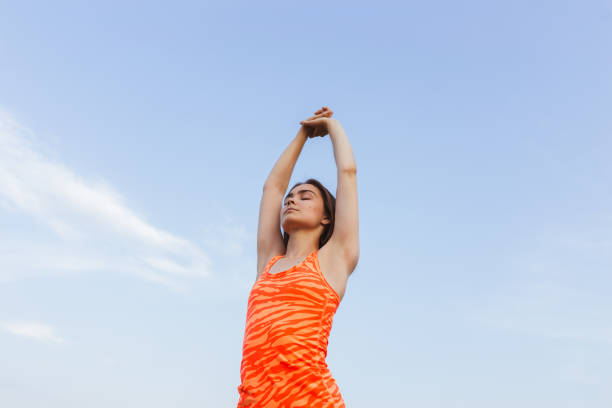 istock Fit female exercising and warming up in summer 1468164258