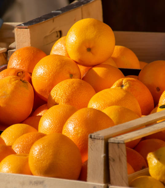 istock Juicy ripe oranges on sale at a market stall 1468166313