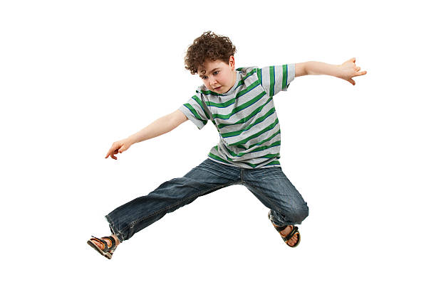 istock Boy jumping isolated on white background 146816858