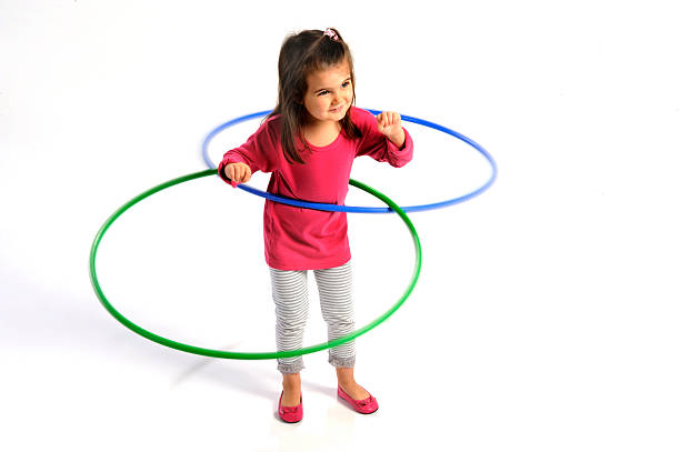 girl hula hoops stock photo