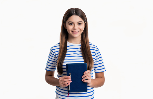 happy teen girl with school diary isolated on white background. teen girl holding school diary in studio. teen girl with school diary book. photo of teen girl hold school diary.