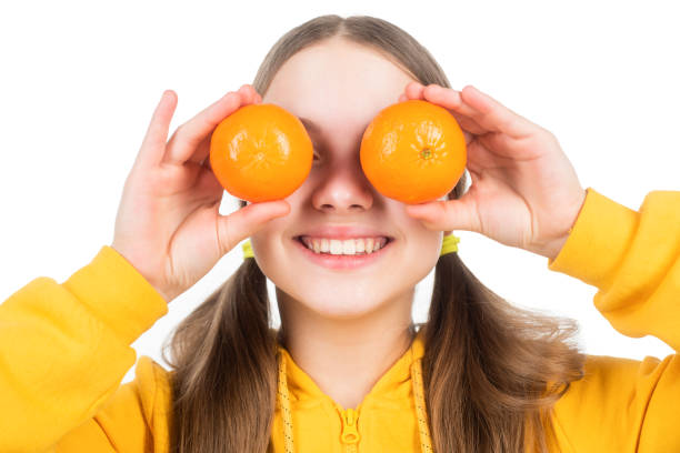 istock happy child hold citrus lemon fruit with vitamins isolated on white, immunity 1468172732