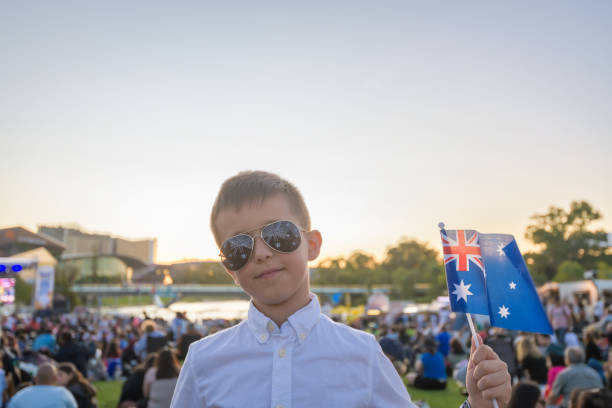 istock Australian kid holding a flag while celebrating Australia day 1468176238