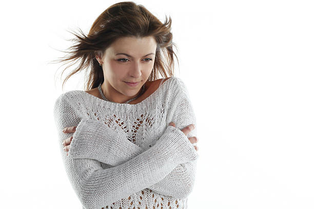 istock freeze from cold woman isolated on white background 146817794