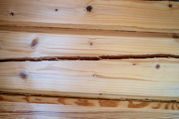 Light wood texture close up. Smooth pine boards are located nearby. Natural macro background. High quality photo.